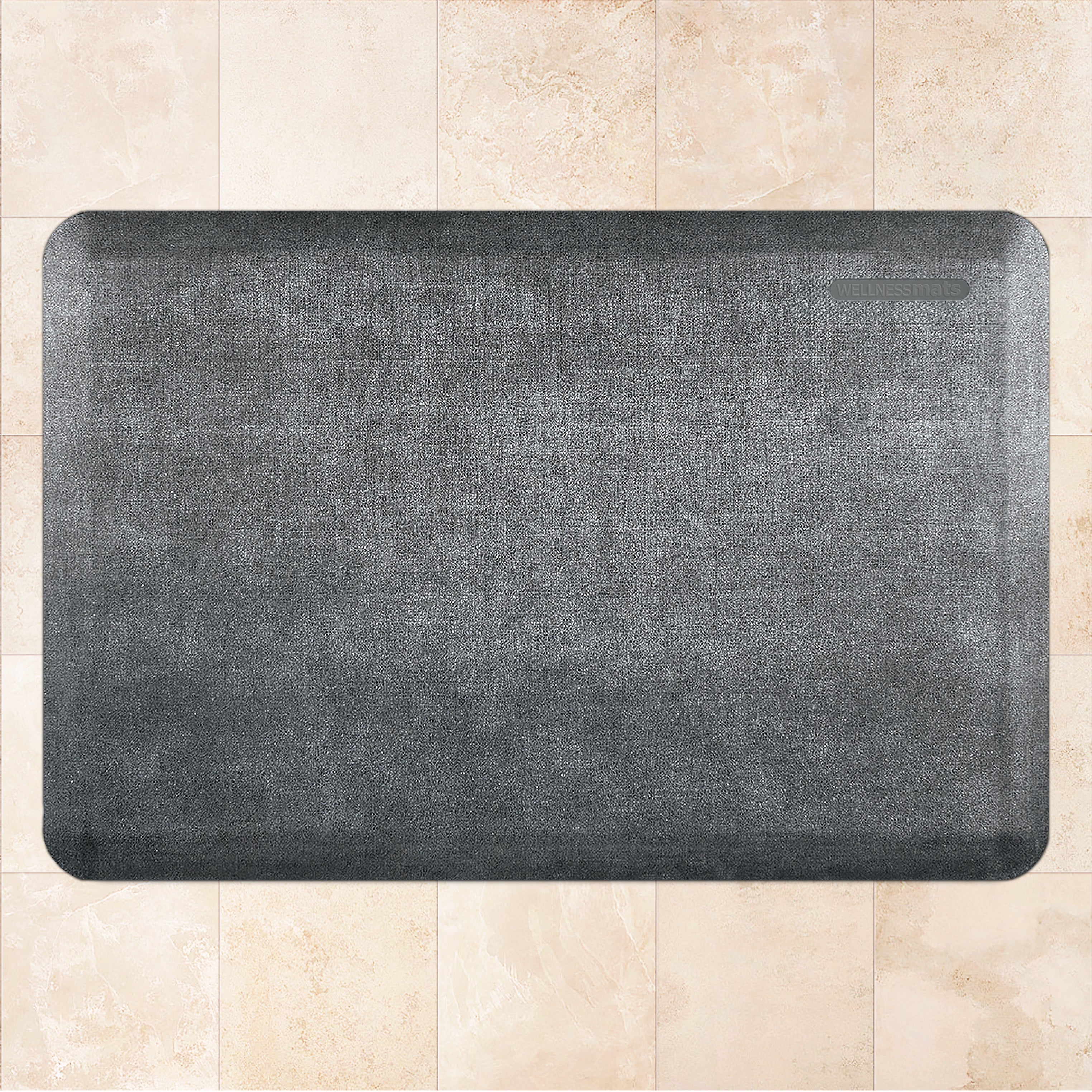 A 3'x2' Linen Slate WellnessMat on a tile floor.