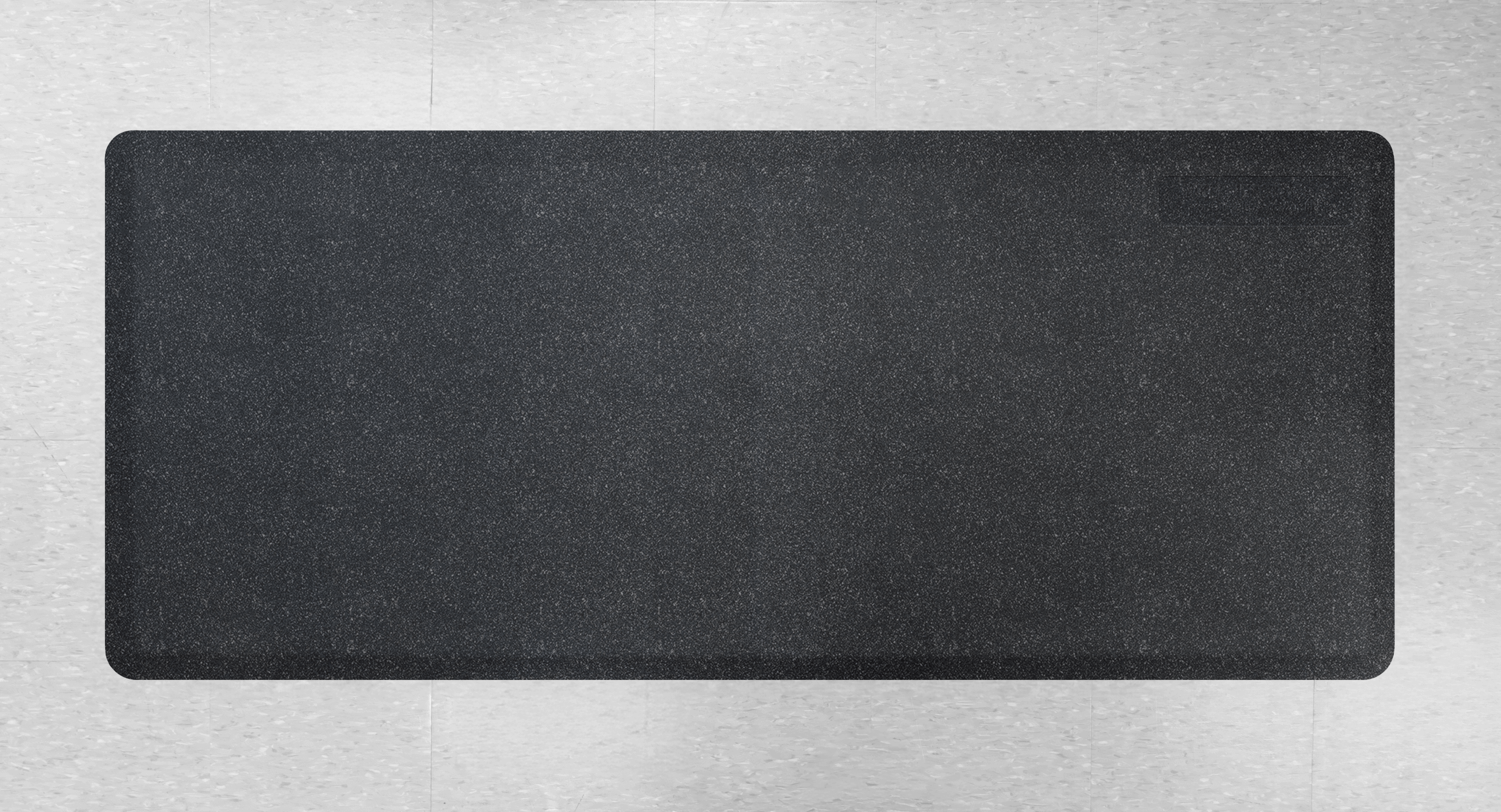 A Granite Onyx FoldingMat on a Tile Floor