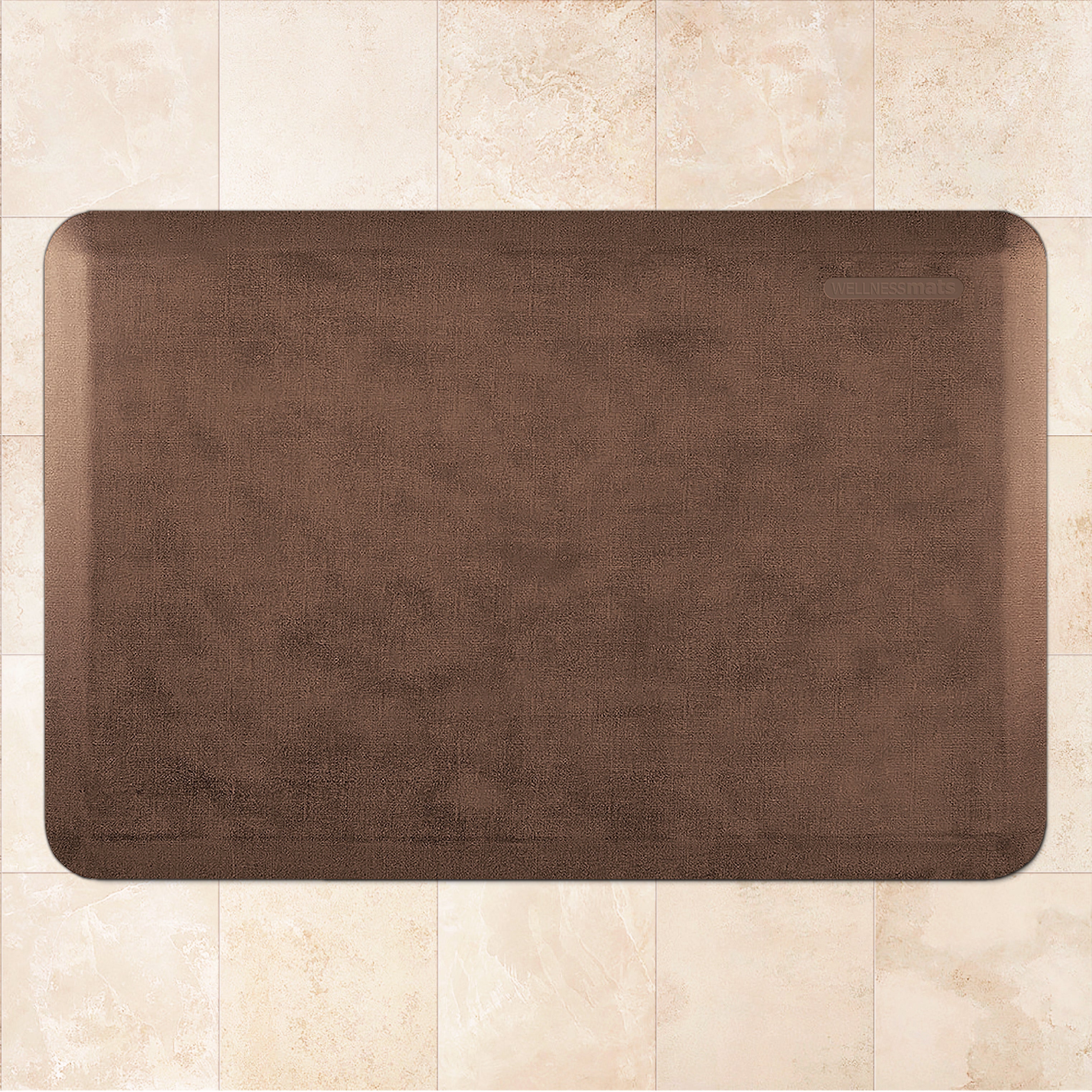 A 3'x2' Antique Light WellnessMat on a tile floor.